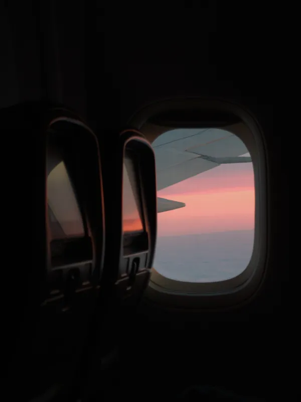 Sunset colors through the airplane window somewhere over the Pacific.